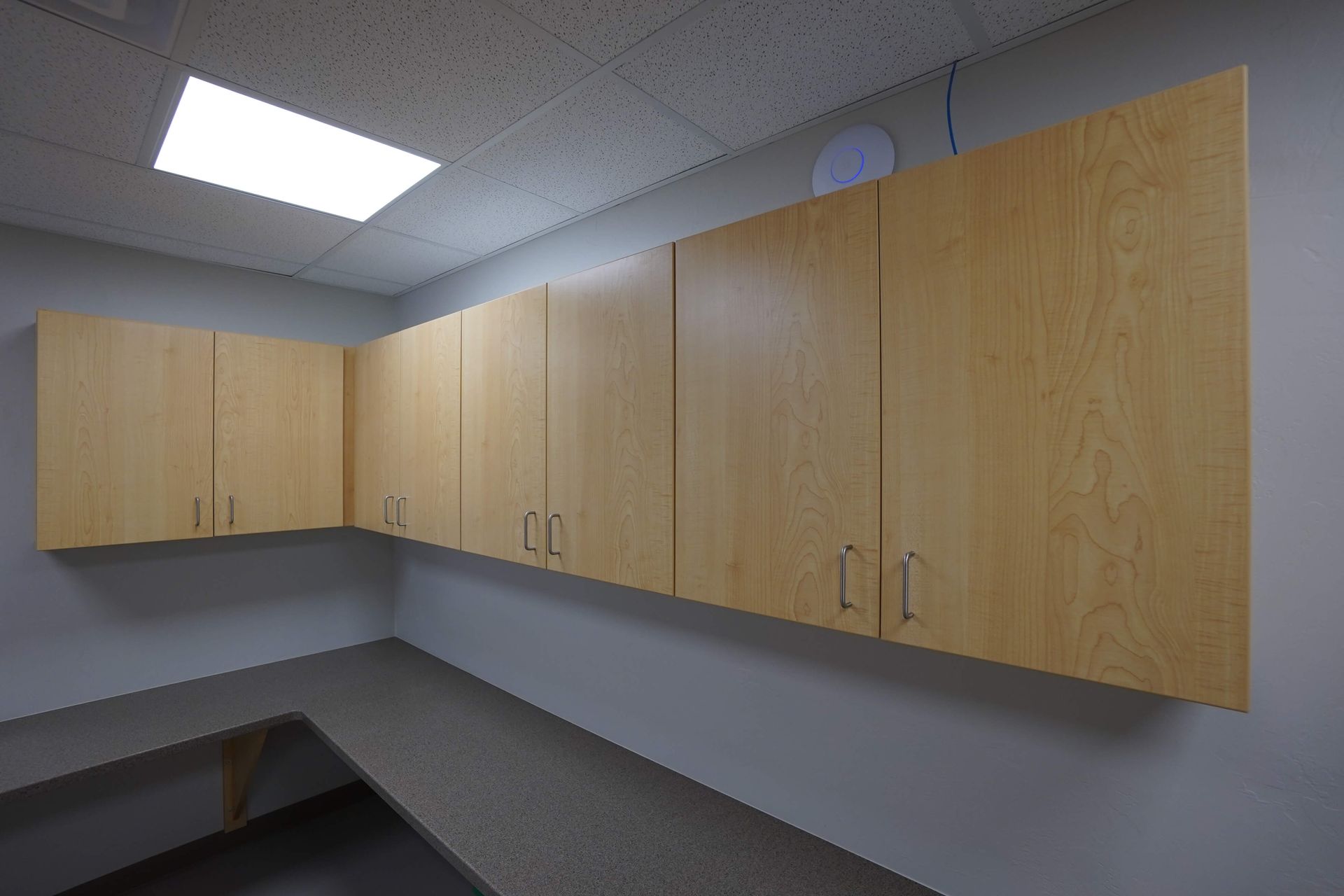 A room with a lot of wooden cabinets on the wall Maven Construction, Montrose, CO