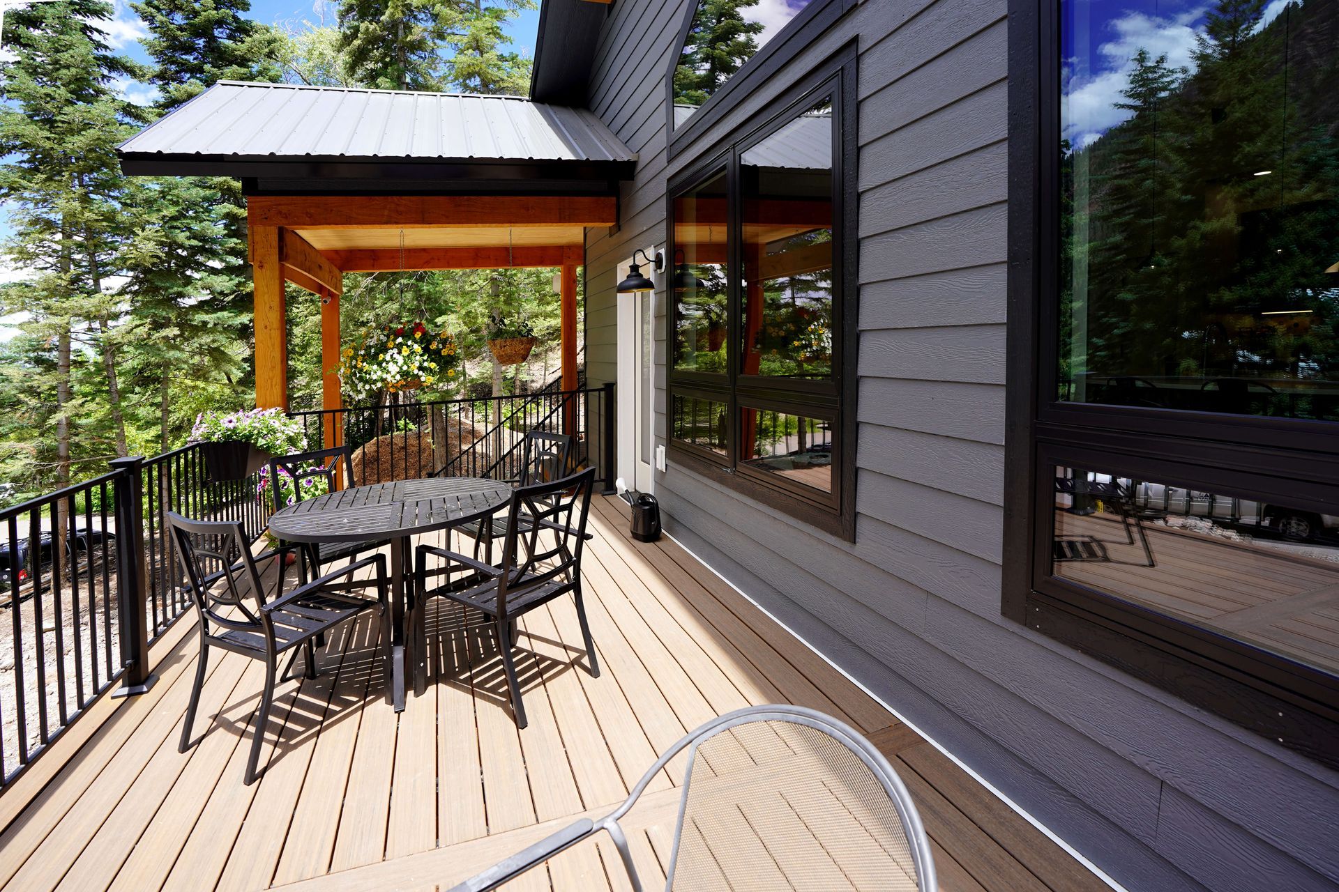 There is a large deck with a table and chairs on it. Maven Construction, Montrose, CO