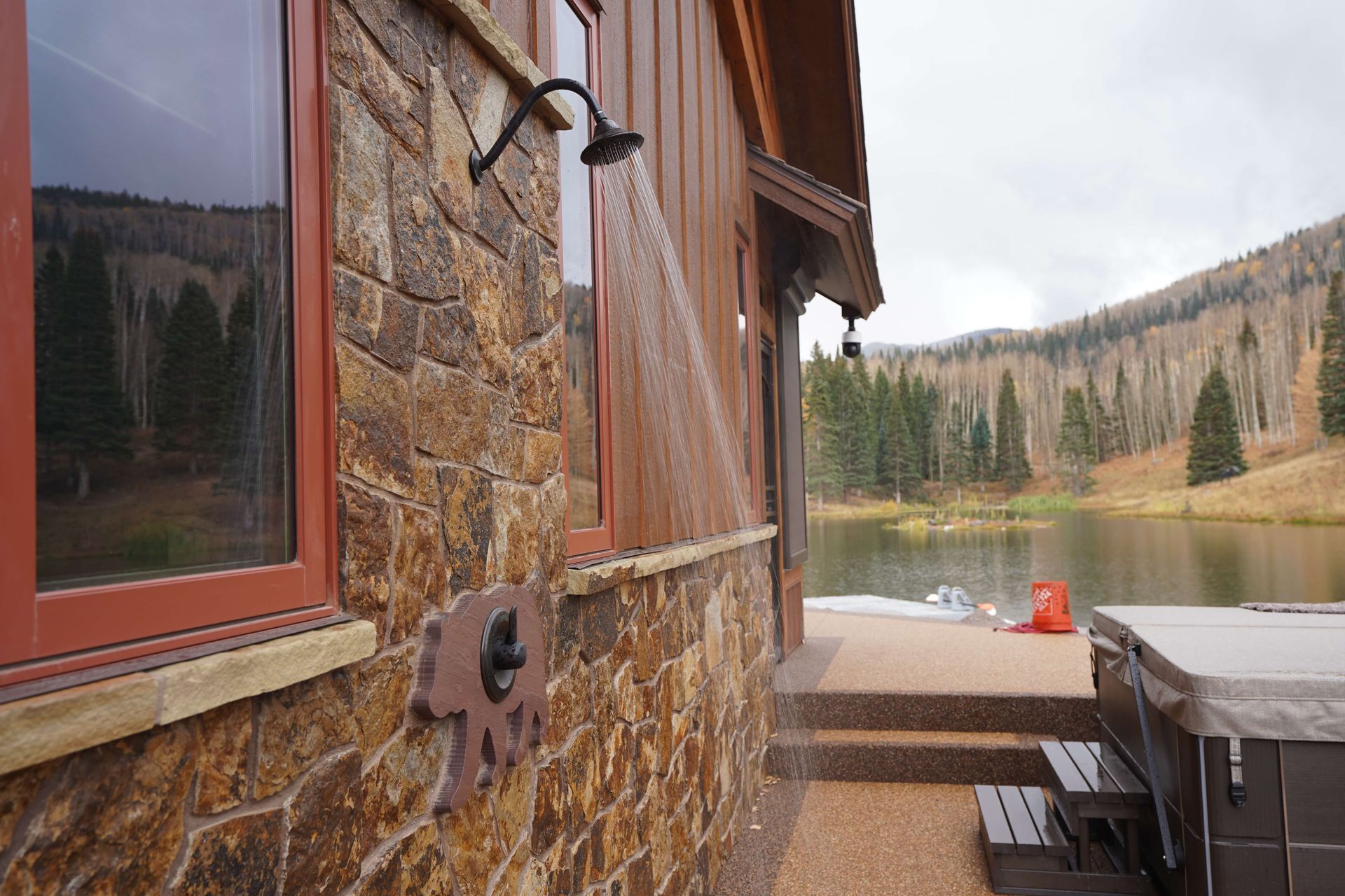 A house with a hot tub and a shower on the side of it. Maven Construction, Montrose, CO