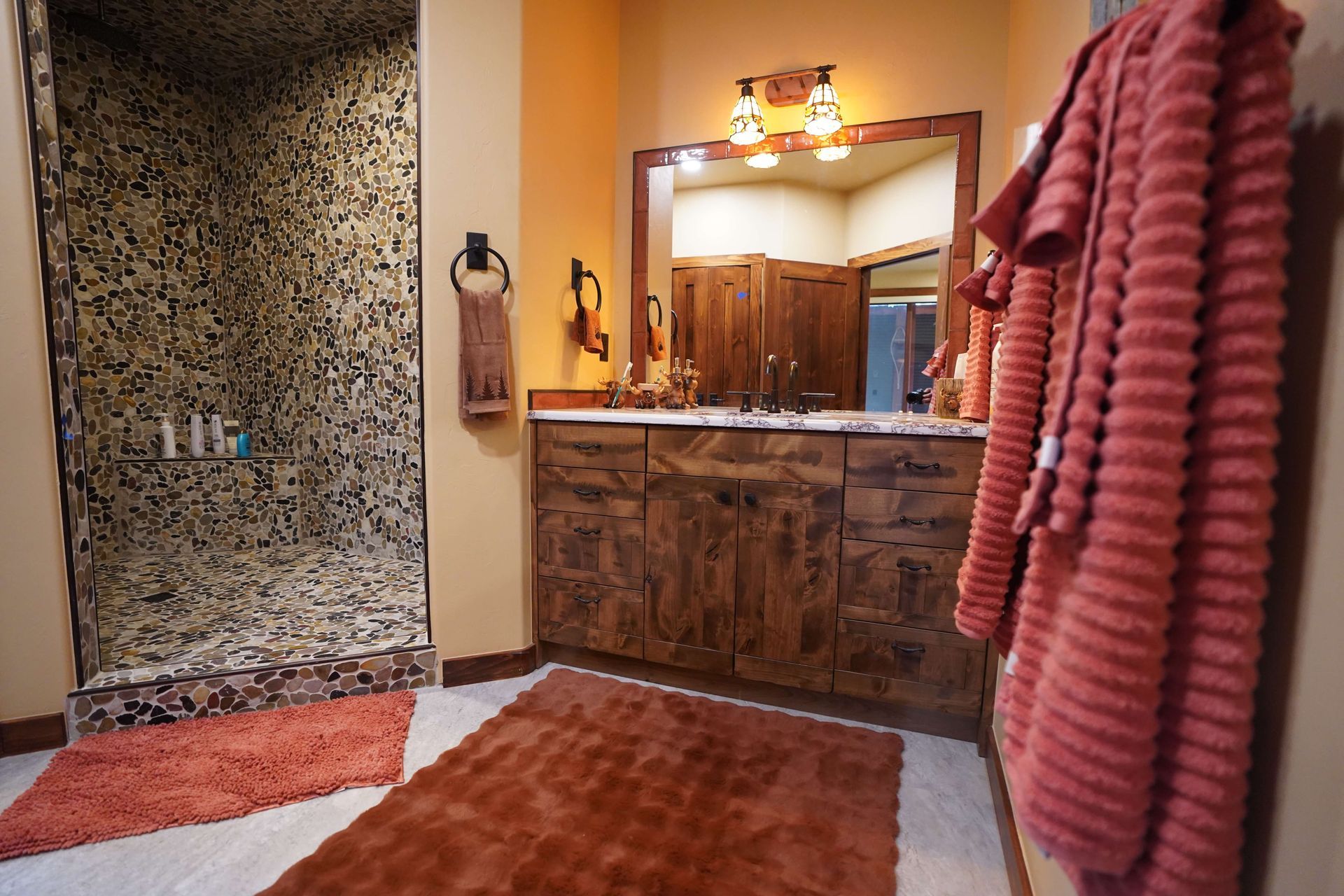A bathroom with two sinks and a walk in shower Maven Construction, Montrose, CO