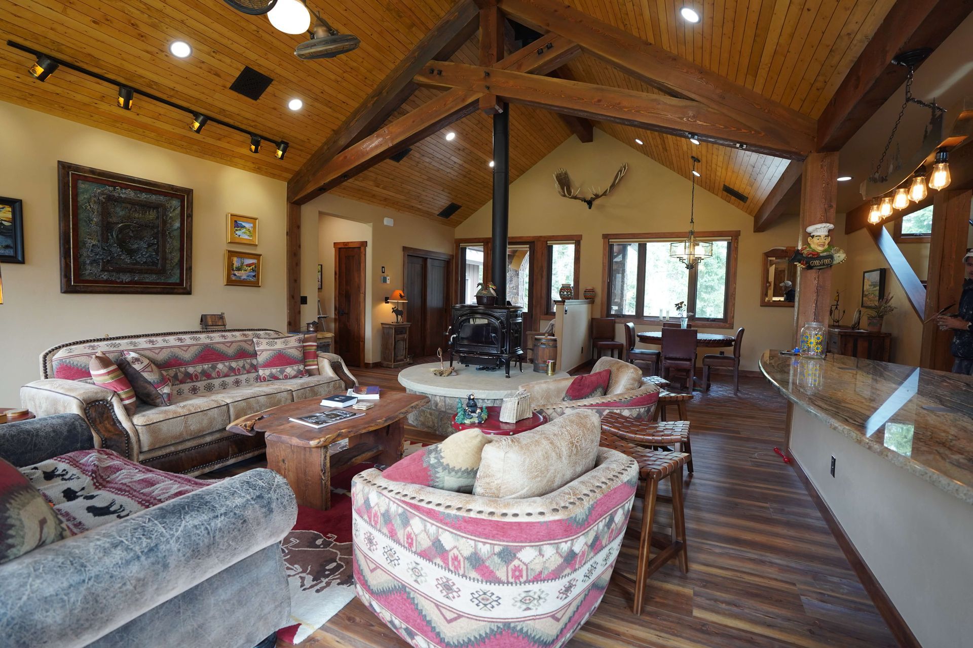 A living room filled with furniture and a fireplace. Maven Construction, Montrose, CO