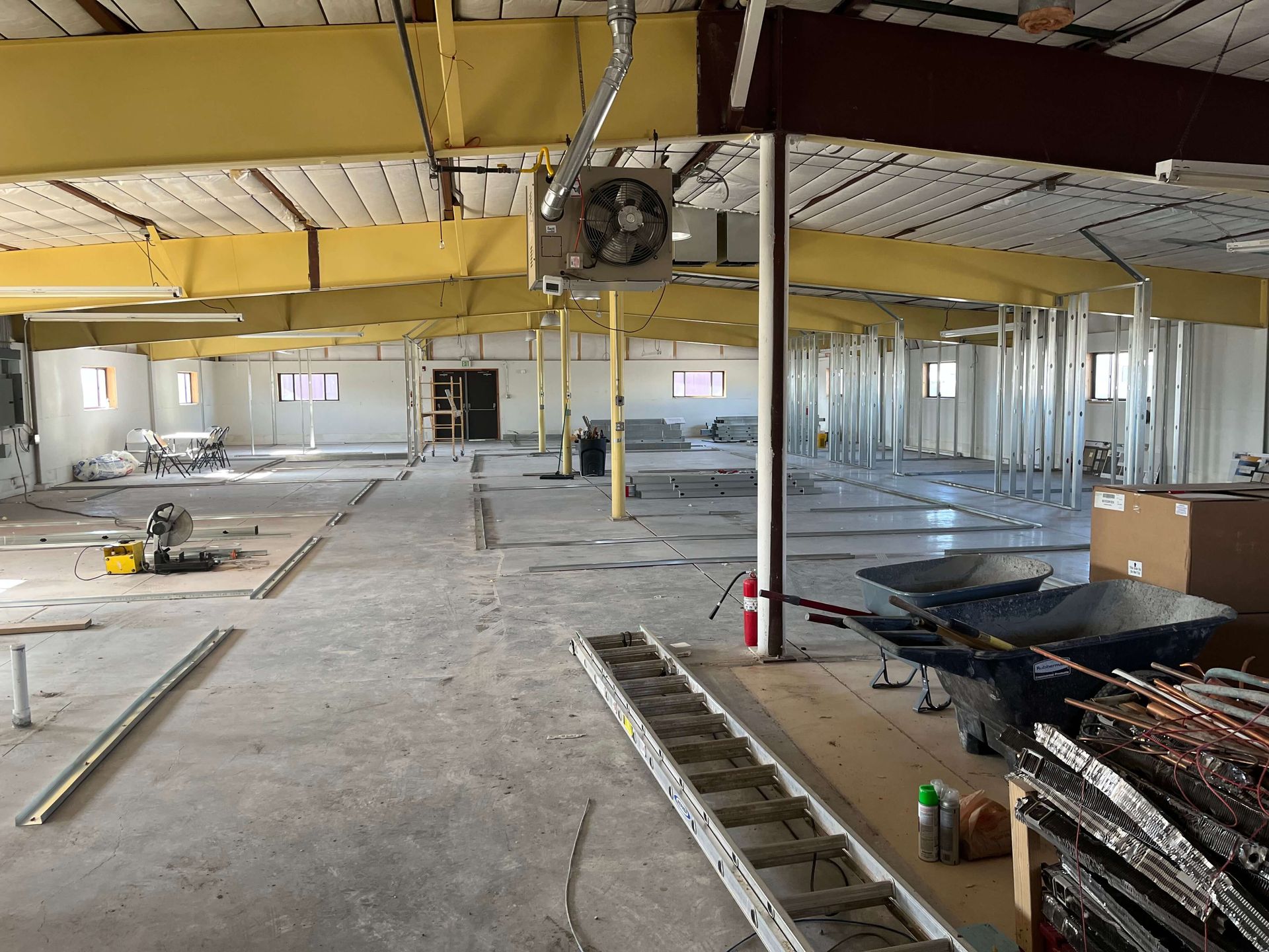 A large building under construction with a fan on the ceiling. Maven Construction, Montrose, CO
