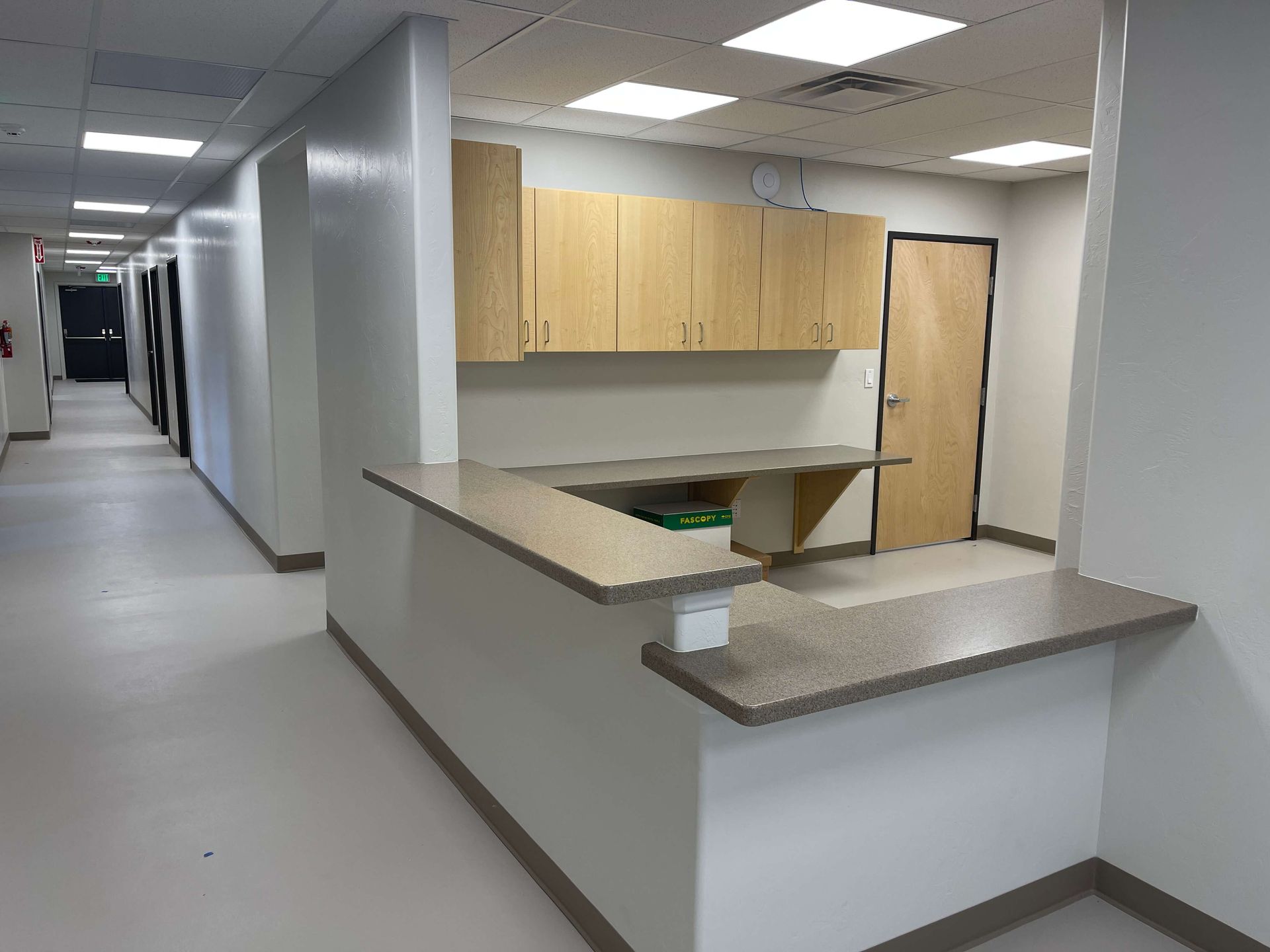 A long hallway with a counter in the middle of it Maven Construction, Montrose, CO