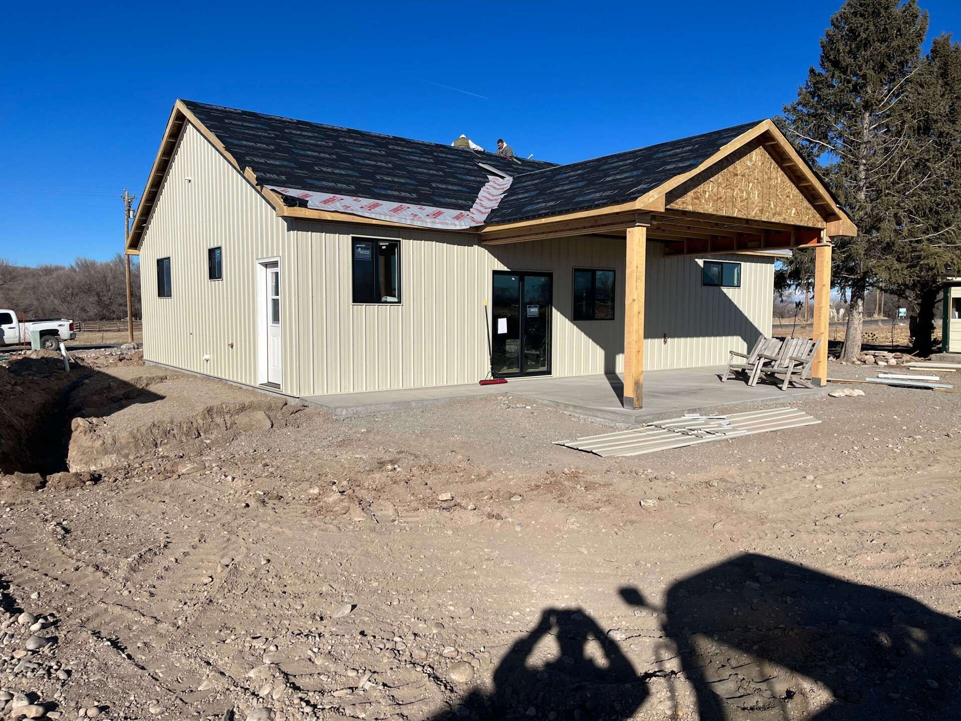 A house is being built in the middle of a dirt field. Maven Construction, Montrose, CO