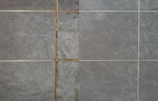 Tile grout cleaning comparison: before (left) is dirty, after (right) is clean; showing gray tiles and light grout lines.