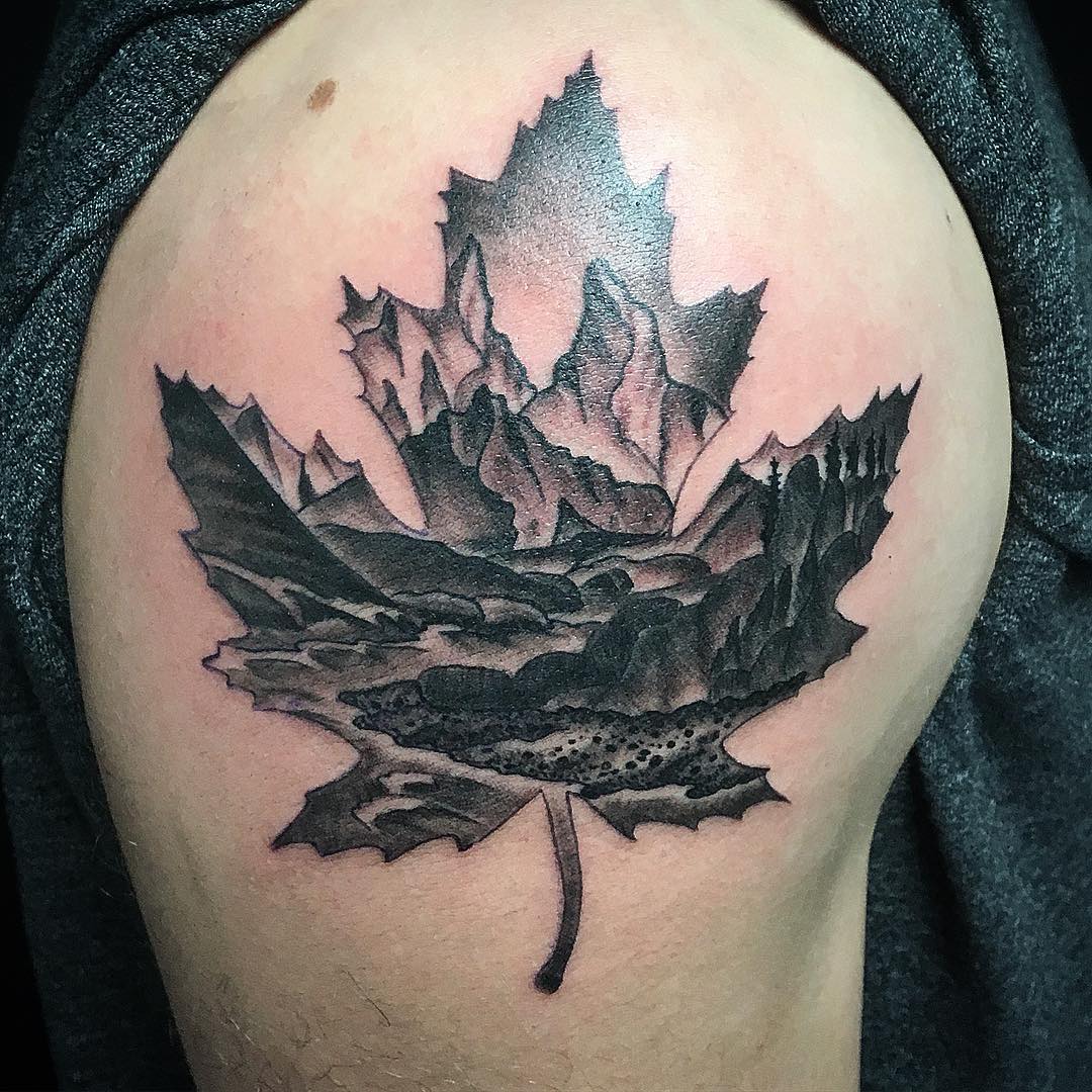 Mountain Scenery in Maple Leaf Tattoo by Dale Moostoos at Crimson Empire Tattoo in Edmonton Alberta Canada