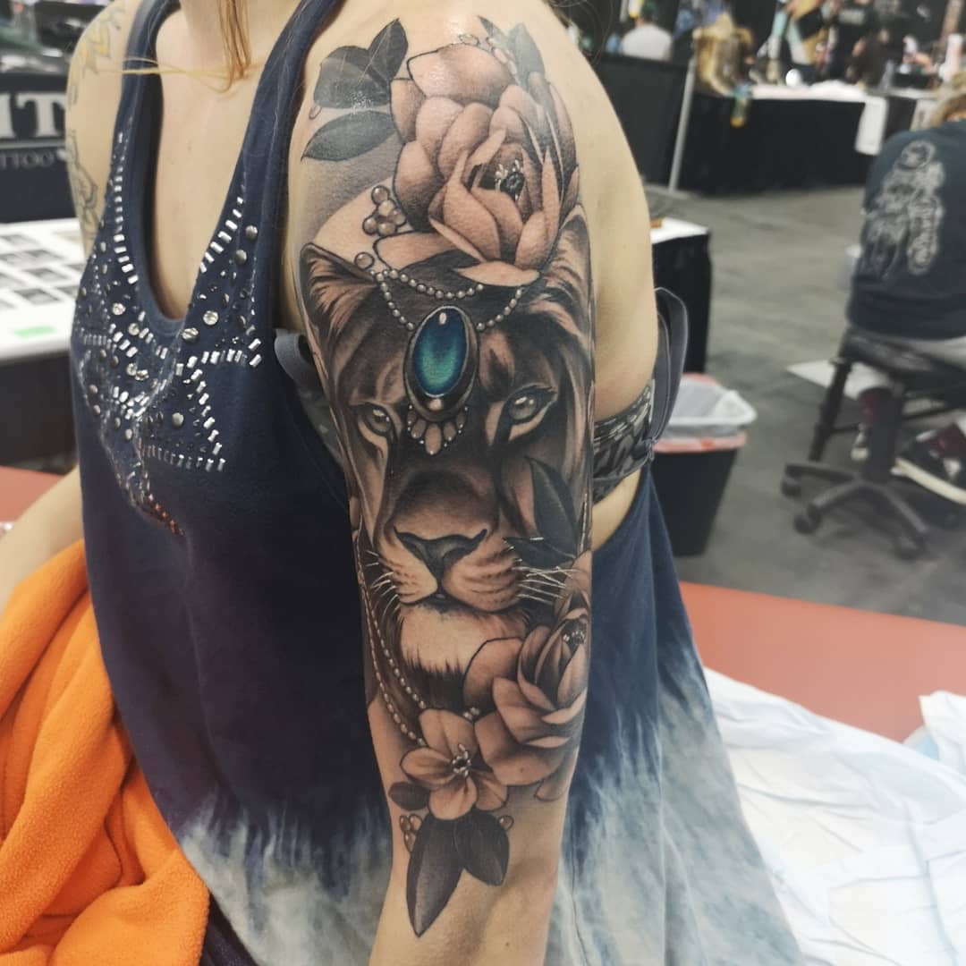 Lion Jewelry and Flowers Tattoo by Sasha Day at Black Gold Tattoo Co in Edmonton Alberta Canada
