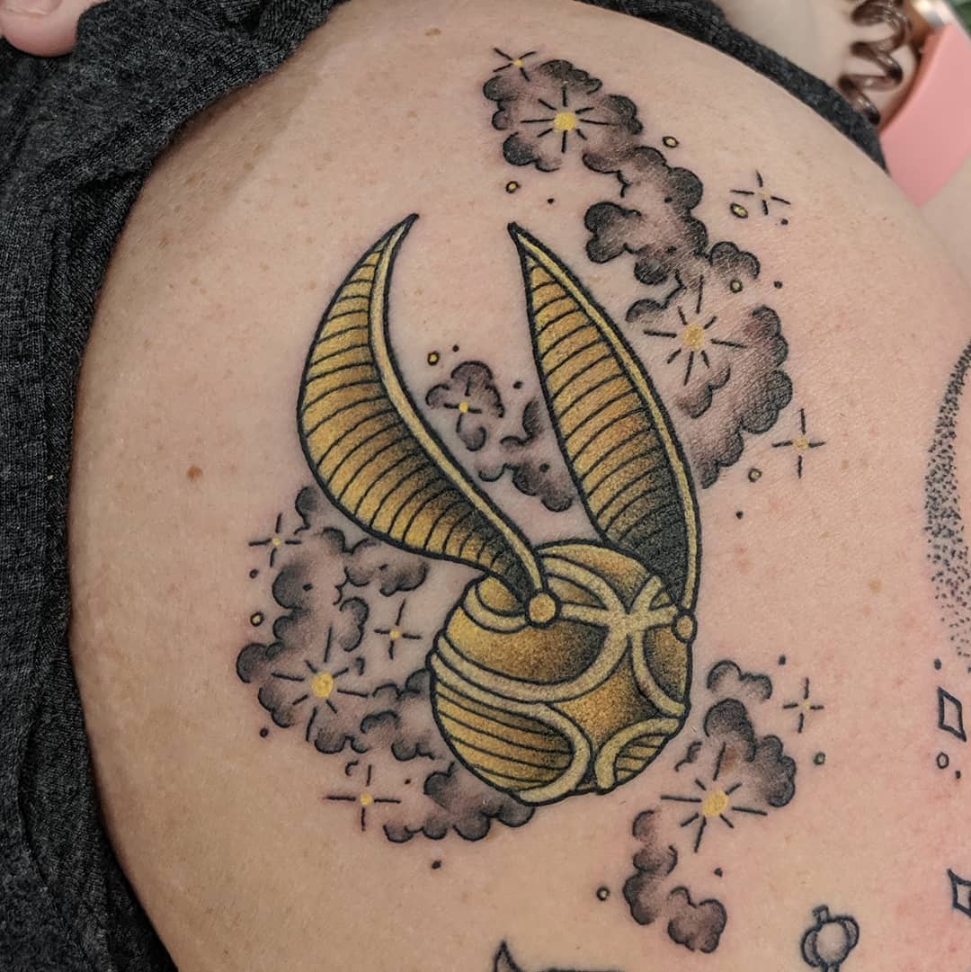 Golden Snitch  (Harry Potter) Tattoo by Sheila Anderson at Crimson Empire Tattoo in Edmonton Alberta Canada
