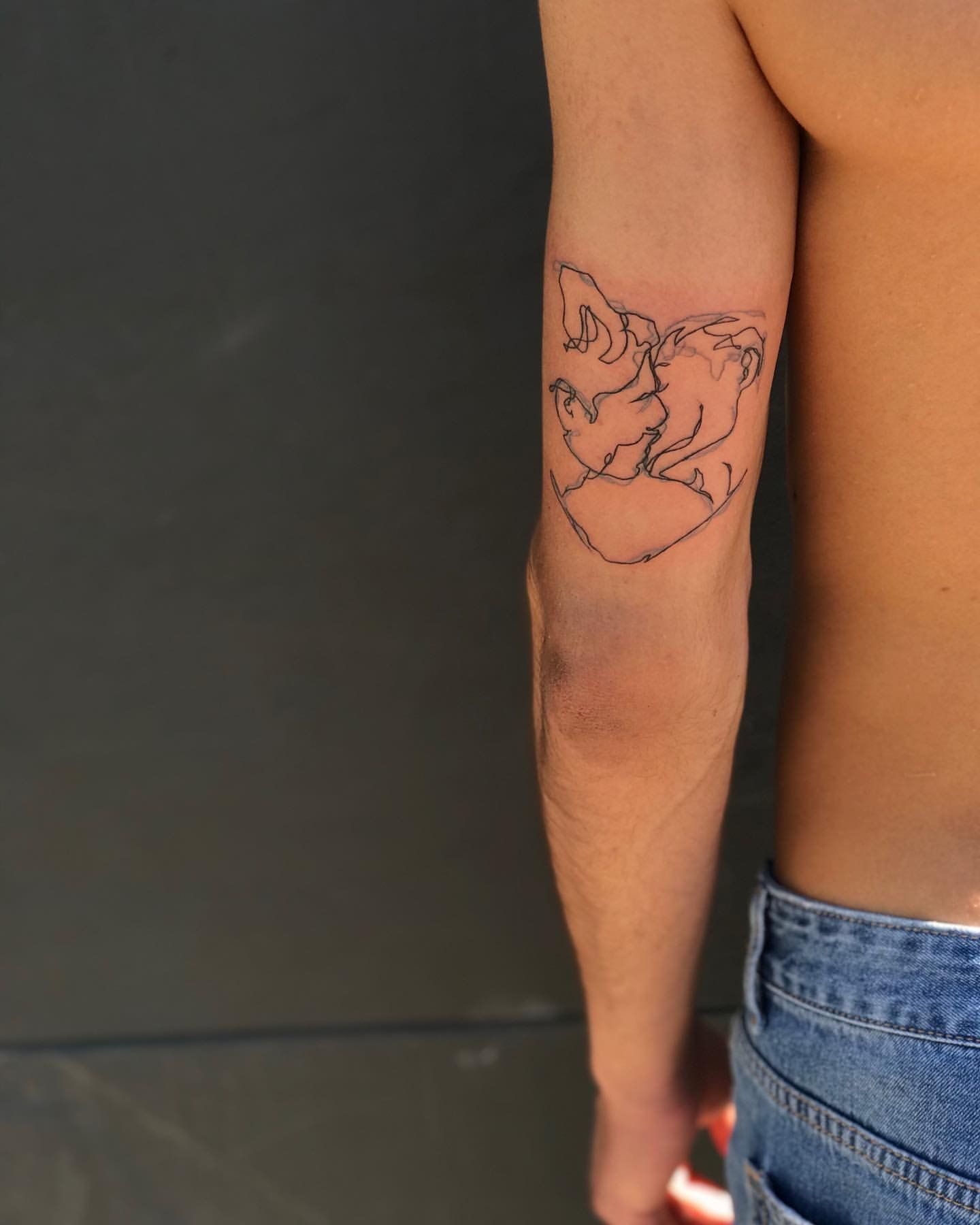 Line Work Kiss Tattoo by Anastasiya at Silver Ghost Tattoo in Edmonton Alberta Canada