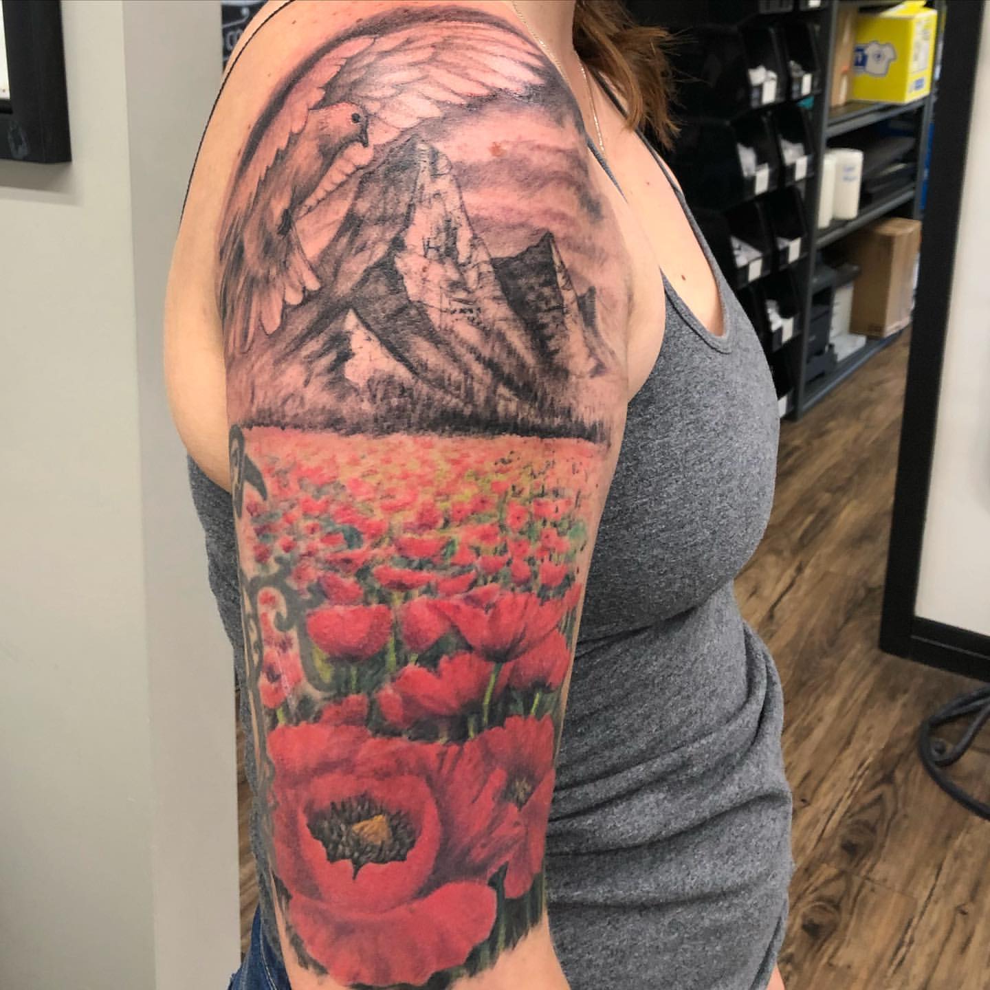 Mountains and Poppy Field Tattoo by Steve Hayes at Black Gold Tattoo Co in Edmonton Alberta Canada