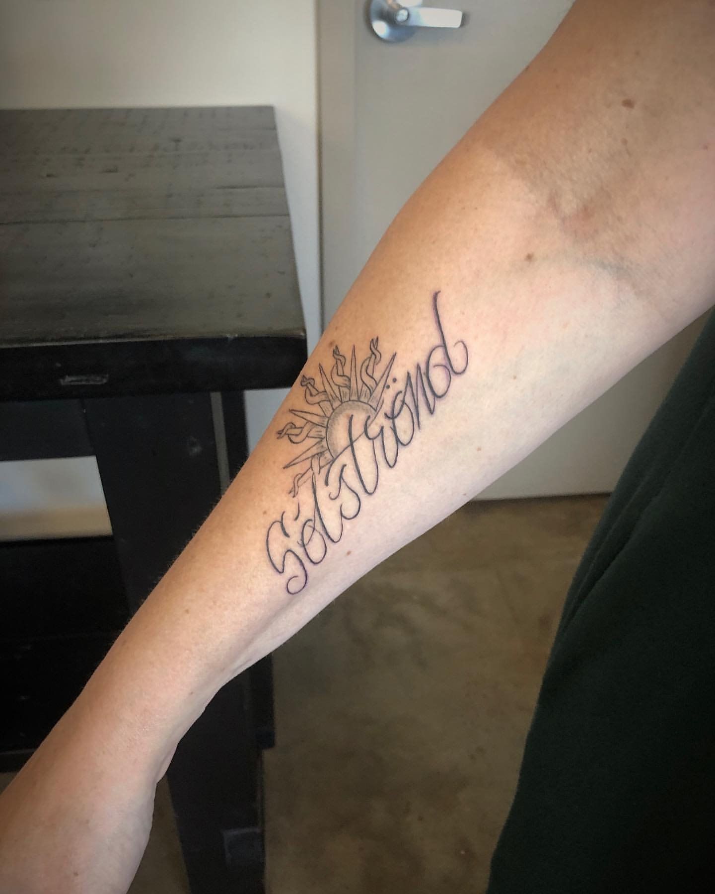 Sun and Script Tattoo by Tony Honning at Crimson Empire Tattoo in Edmonton Alberta Canada