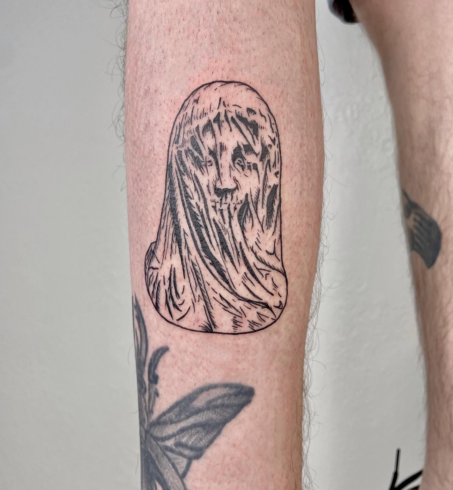 Statue Tattoo by Liza Kruk at Silver Ghost Tattoo in Edmonton Alberta Canada