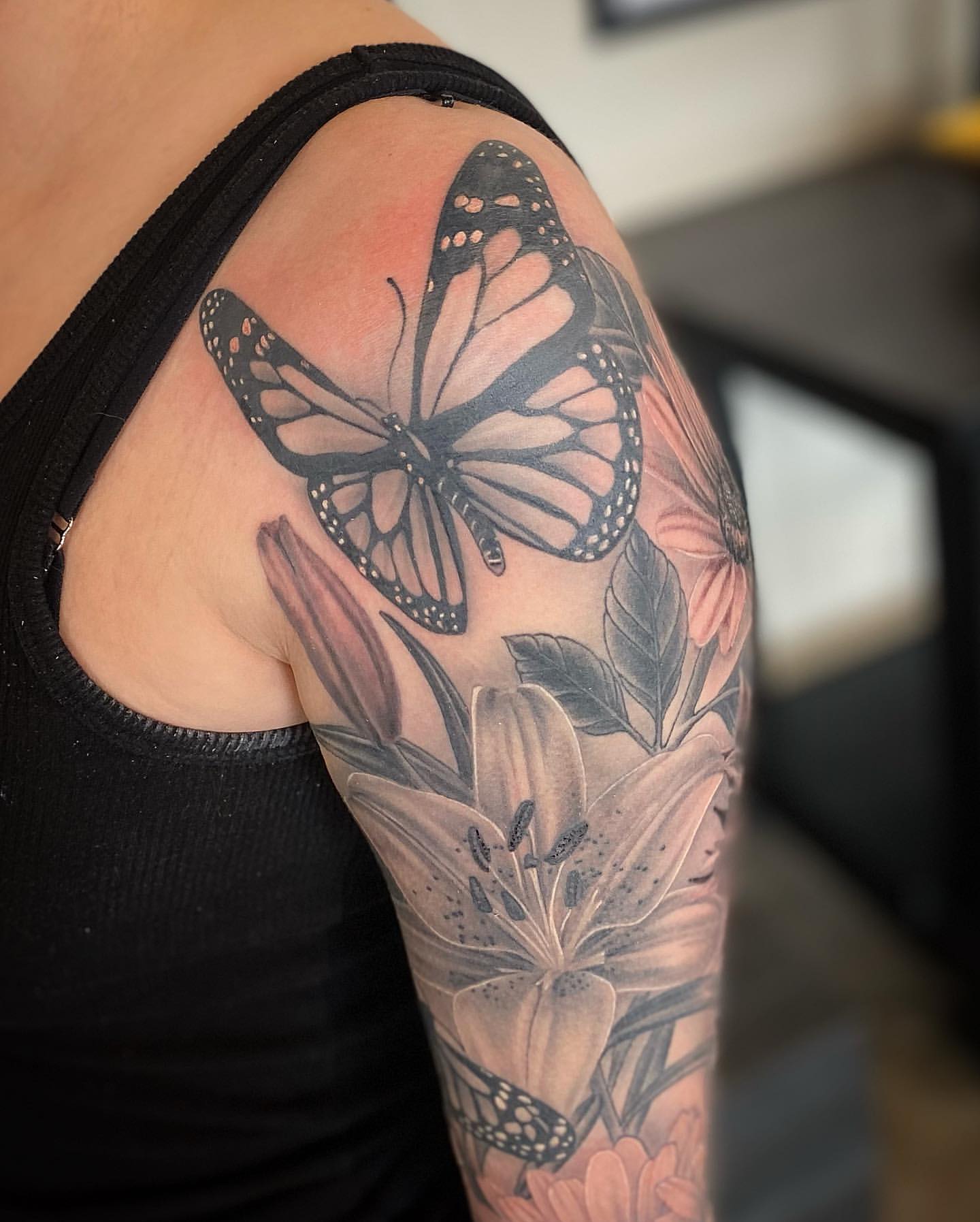 Butterflies and Lilies Tattoo by Dale Moostoos at Crimson Empire Tattoo in Edmonton Alberta Canada