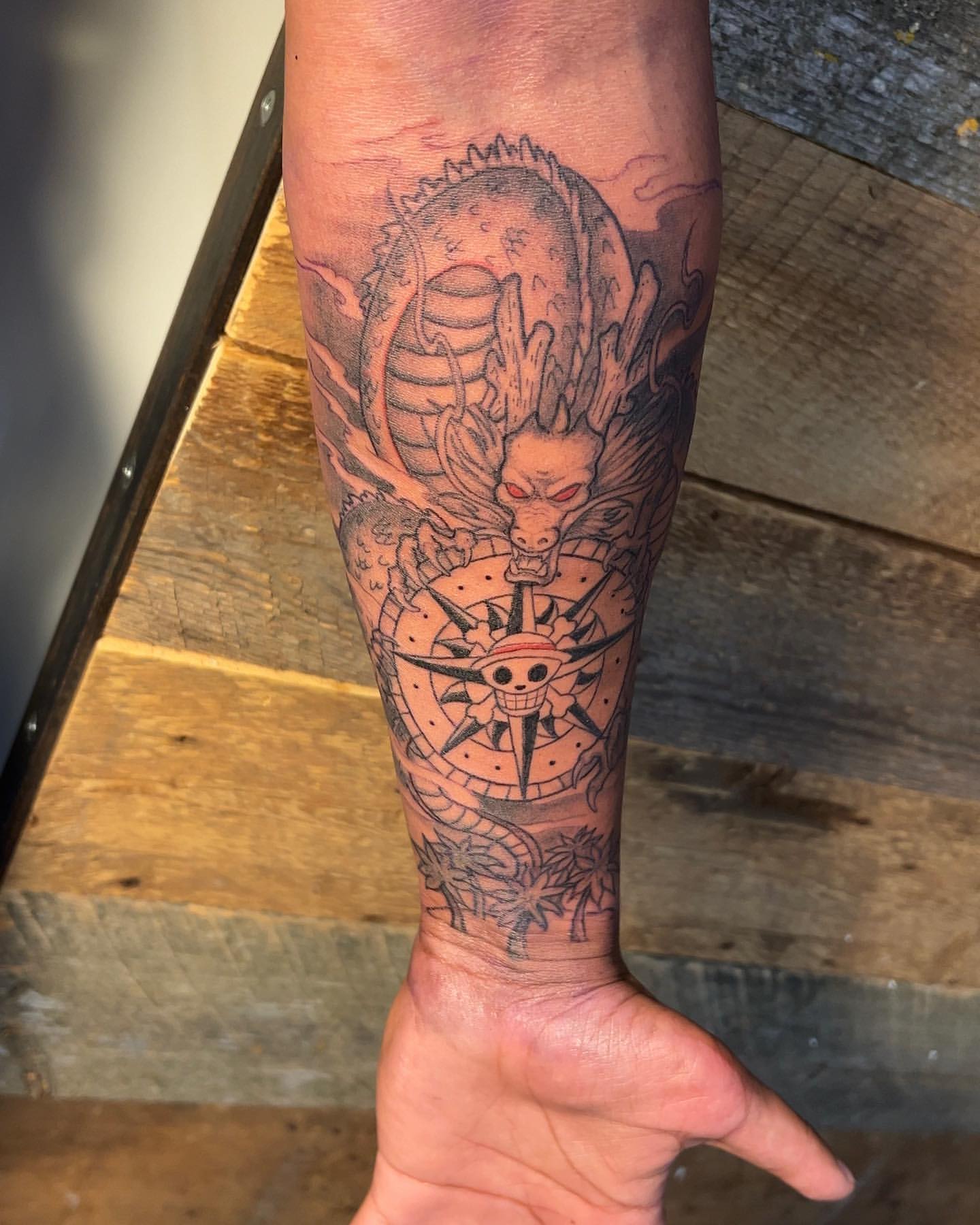 Shenron and One Piece Compass Tattoo by Vinny Nguyen at Crimson Empire Tattoo in Edmonton Alberta Canada