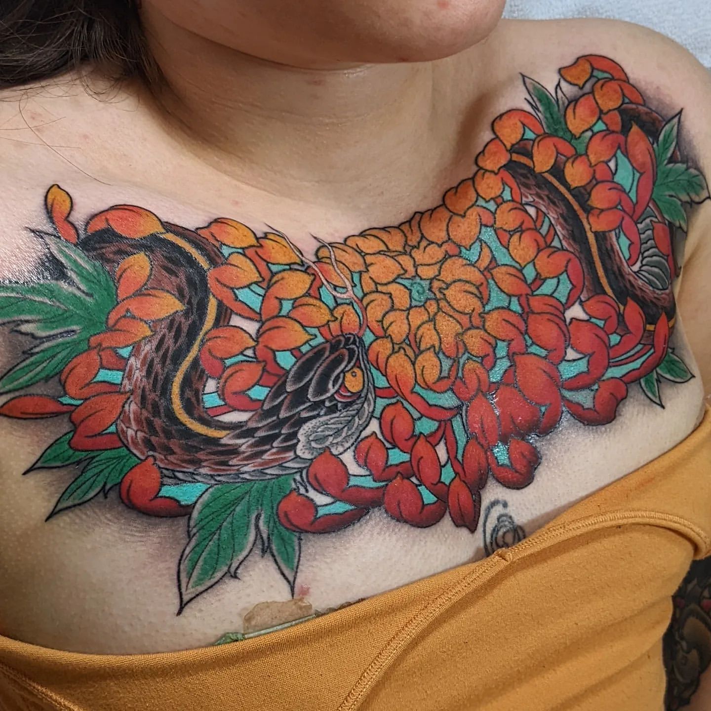 Snakes and Chrysanthemums Chest Tattoo Chris Benson at Silver Ghost Tattoo in Edmonton Alberta Canada