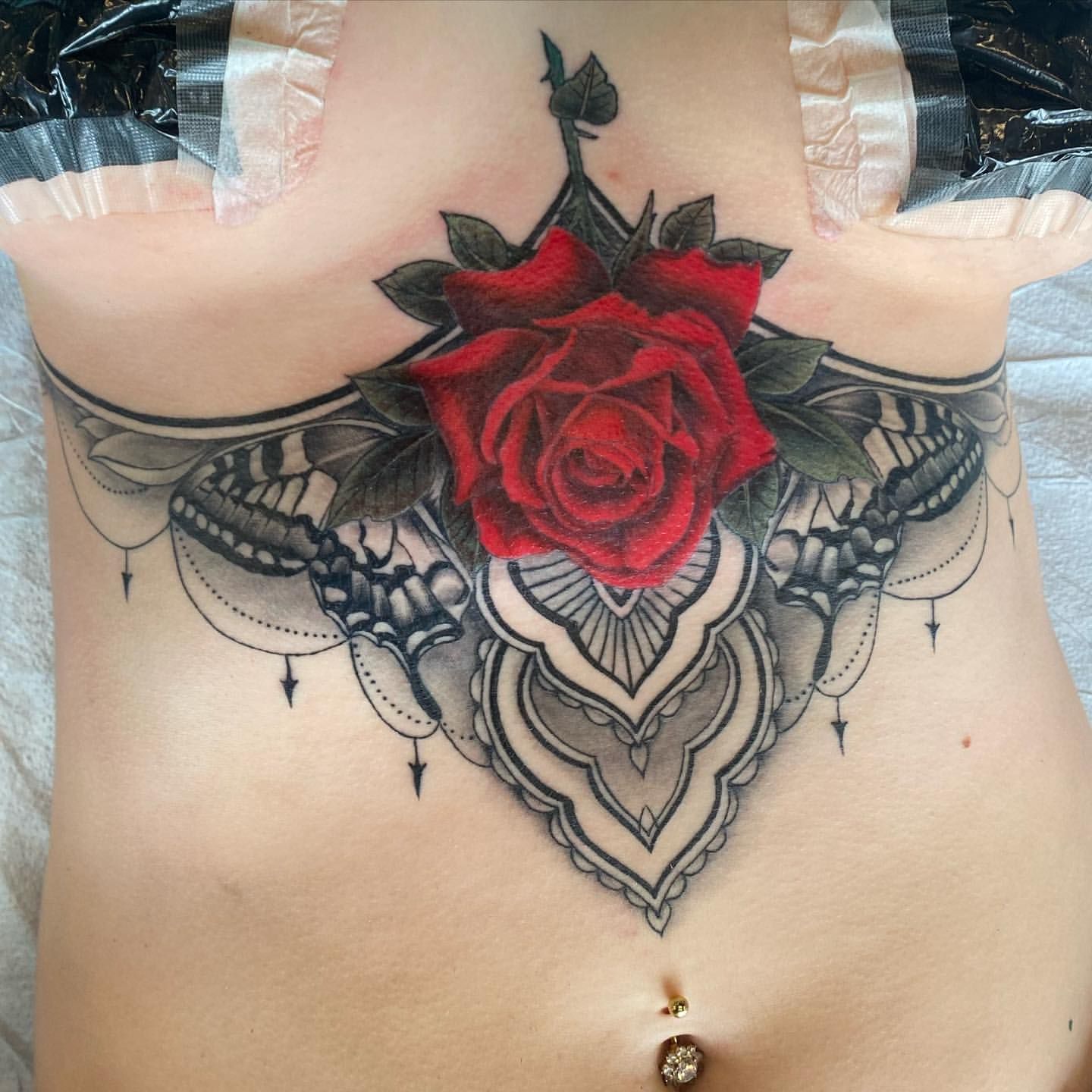 Rose and Mandala Sternum Tattoo by Dale Moostoos at Crimson Empire Tattoo in Edmonton Alberta Canada