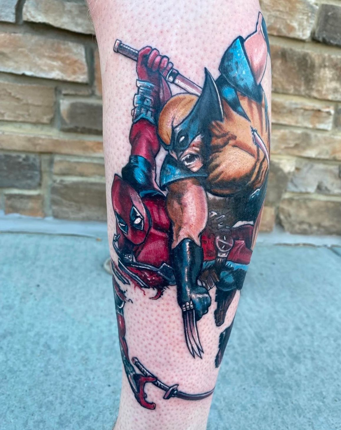 Deadpool Vs Wolverine Tattoo by Chris Labrenz at Black Gold Tattoo Co in Edmonton Alberta Canada