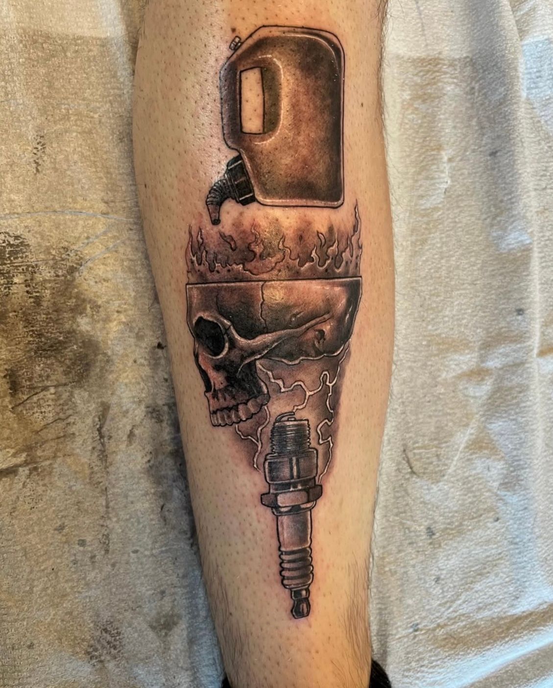 Skull, Gasoline and Spark Plug Tattoo by Chad Lavers at Crimson Empire Tattoo in Edmonton Alberta Canada