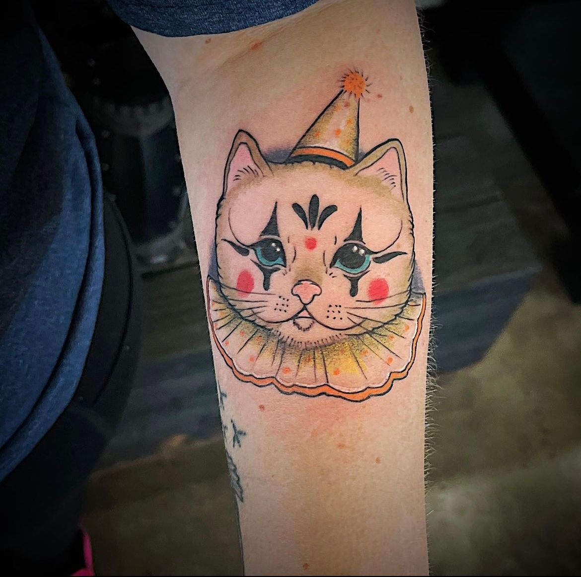 Clown Cat Tattoo by Tony Honning at Silver Ghost Tattoo in Edmonton Alberta Canada
