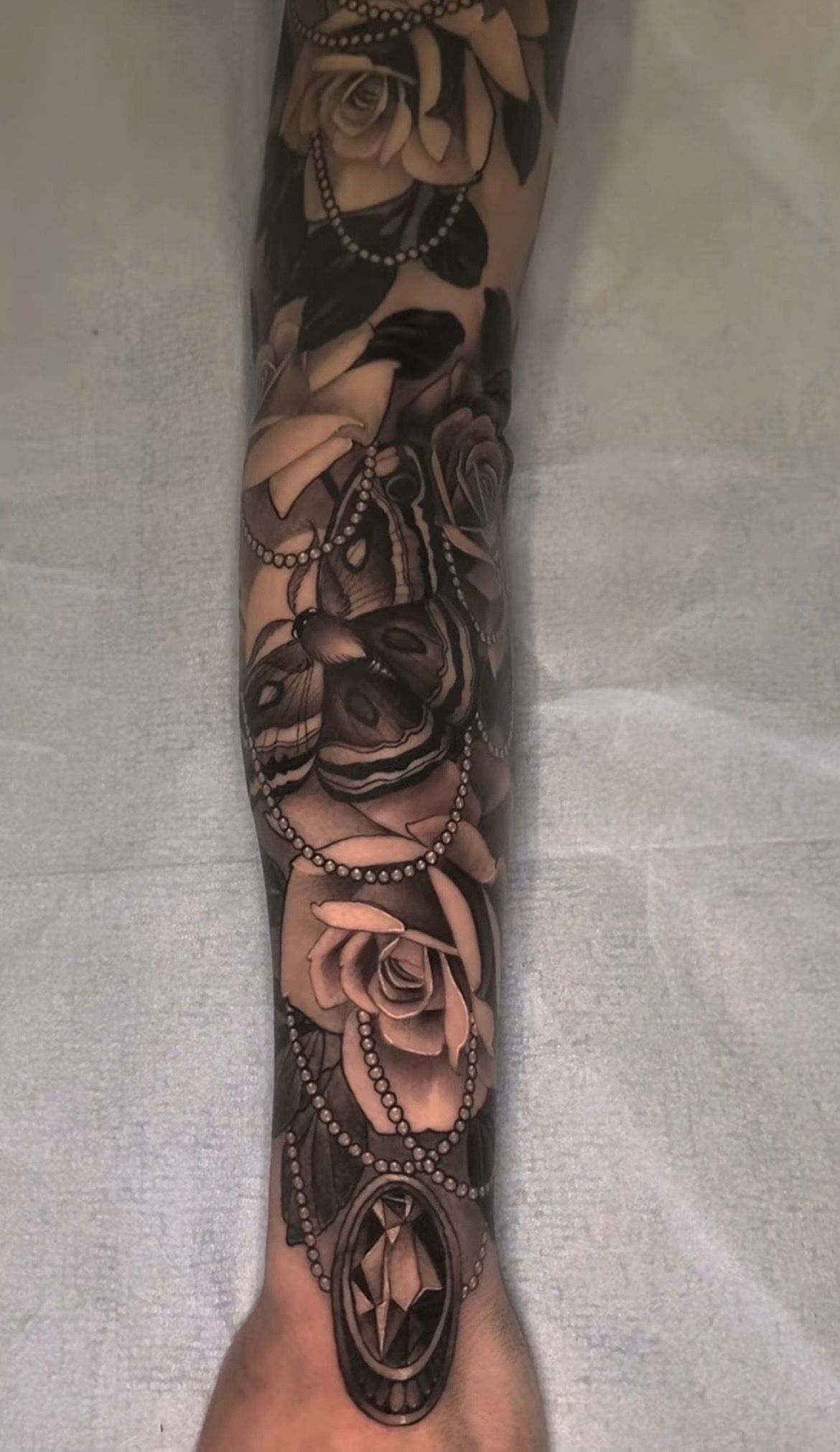 Moth and Floral Tattoo by Sasha Day at Crimson Empire Tattoo in Edmonton Alberta Canada