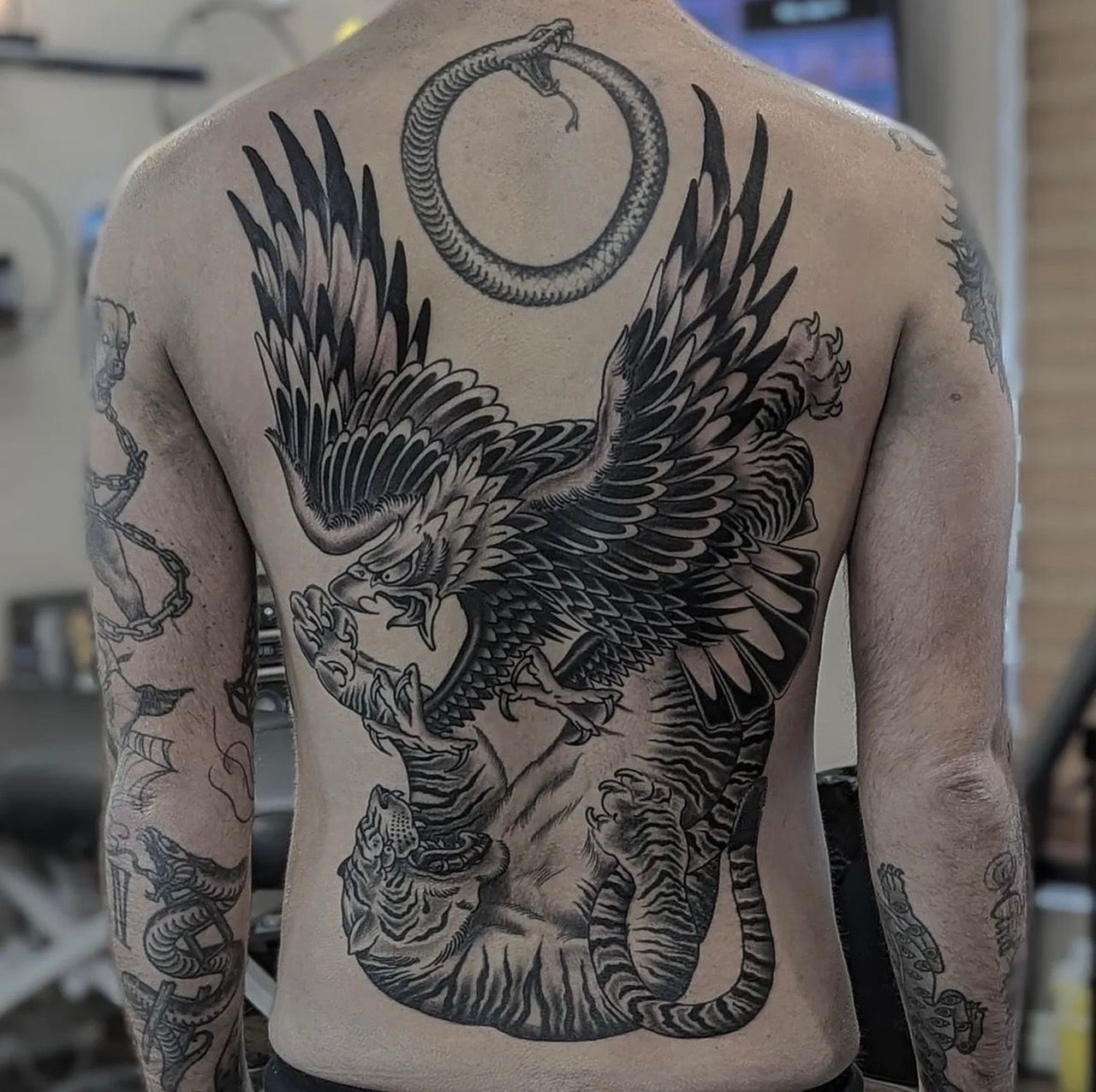 Eagle and Tiger Backpiece by Chris Benson at Silver Ghost Tattoo in Edmonton Alberta Canada