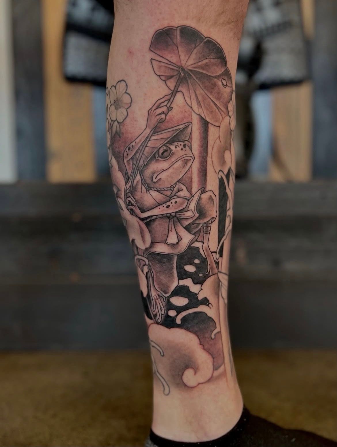 Frog with Lily Pad Umbrella Tattoo by Curt Semeniuk at Crimson Empire Tattoo in Edmonton Alberta Canada