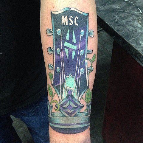 Guitar Tattoo by Trevor Pelletier at Black Gold Tattoo Co in Edmonton Alberta Canada