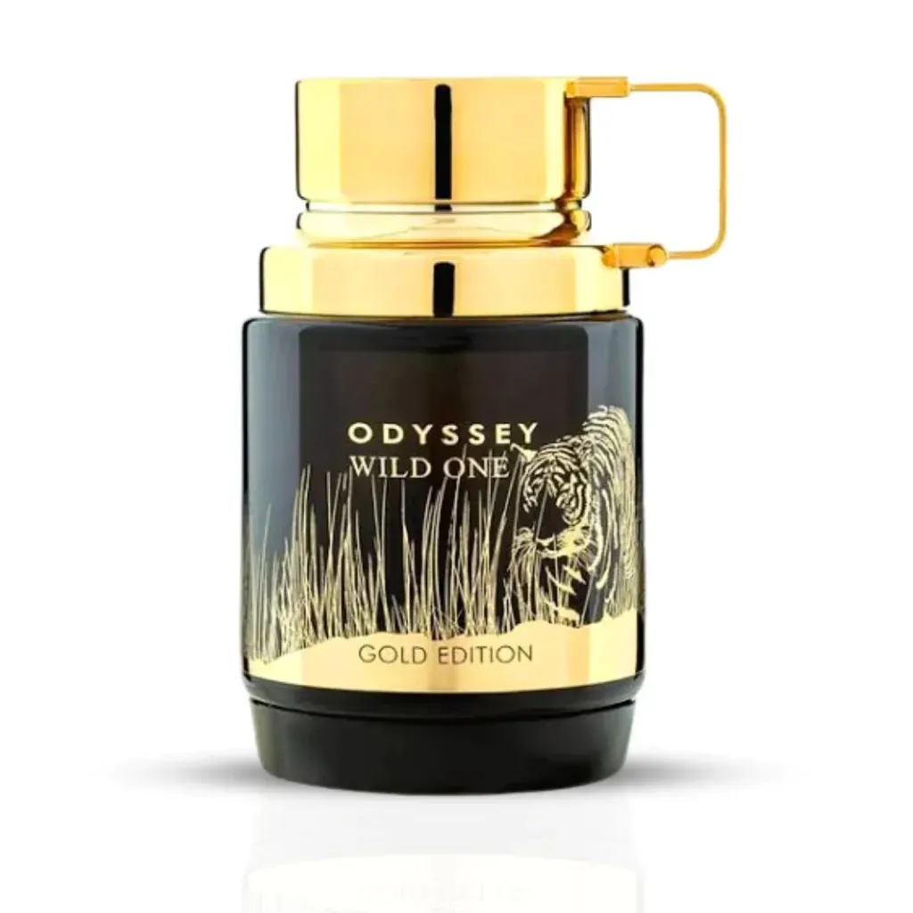 Frasco y caja de perfume en negro y dorado. «Odyssey Wild One» con diseño de tigre, en dorado sobre negro.