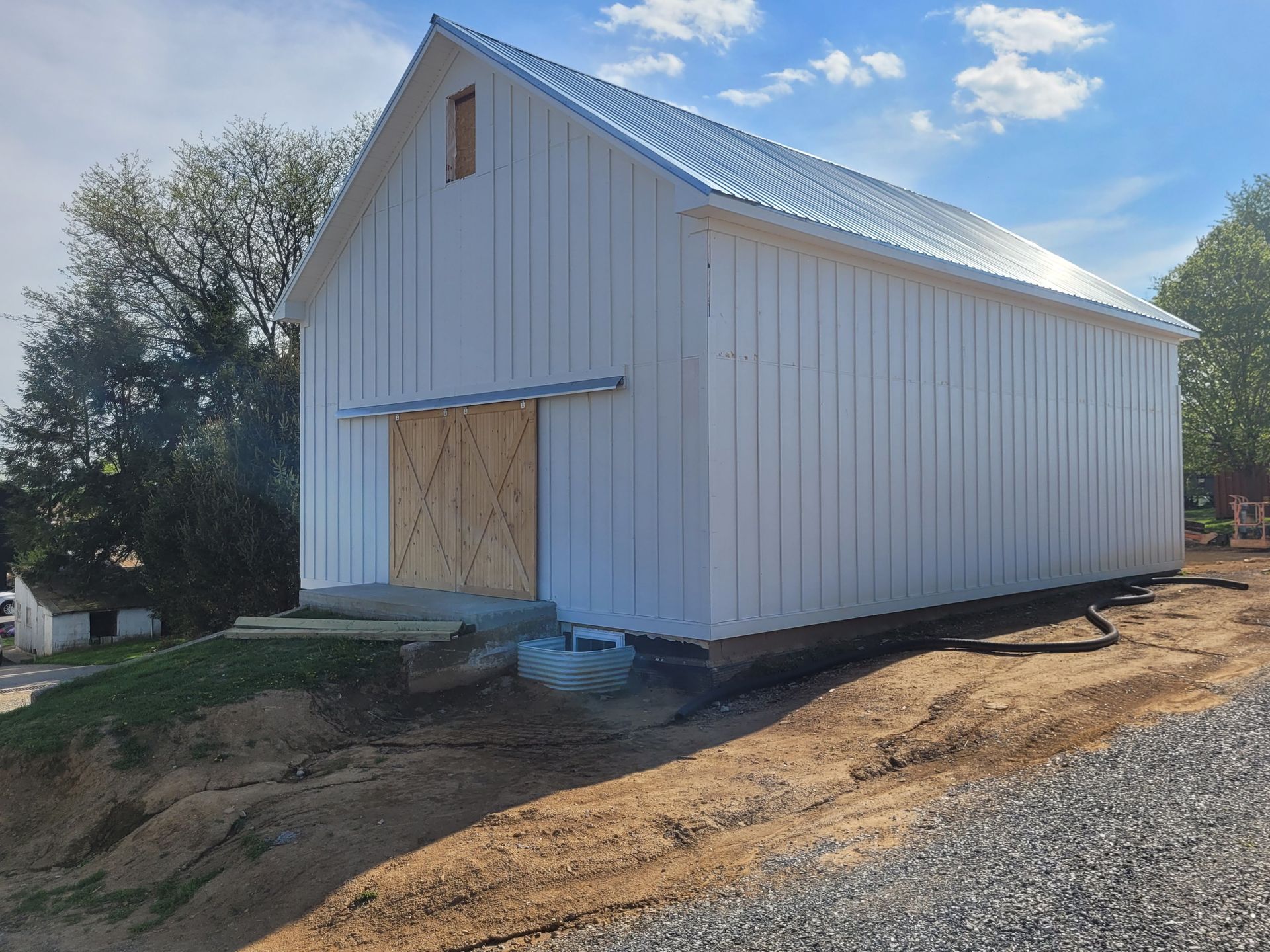 The sun is shining through the windows of a building under construction.