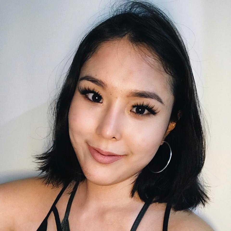 a Korean professional poses for a selfie