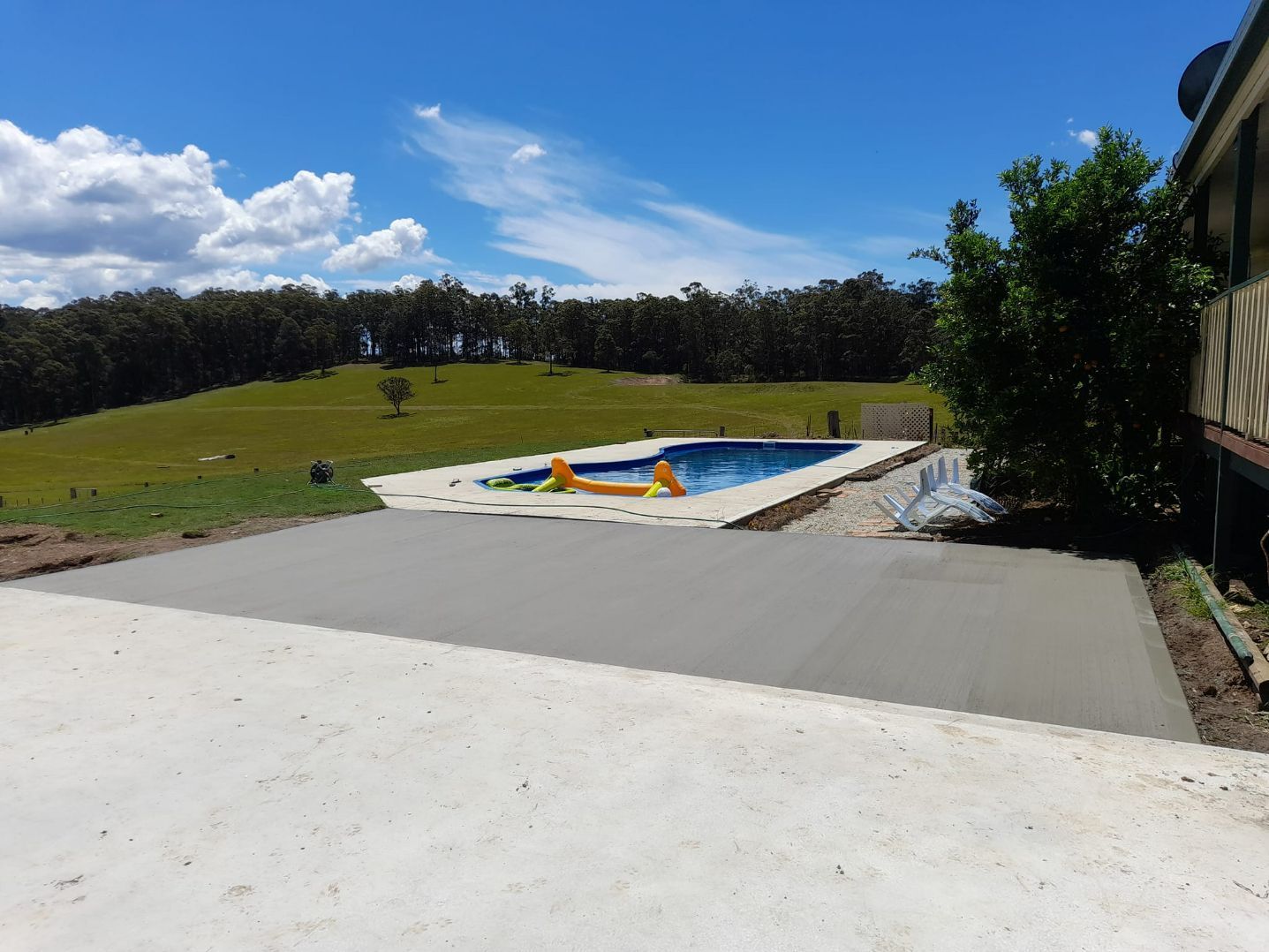 Concrete Floor Beside the Pool on a Sunny Day — Kempsey Concrete Contractors In Kempsey, NSW