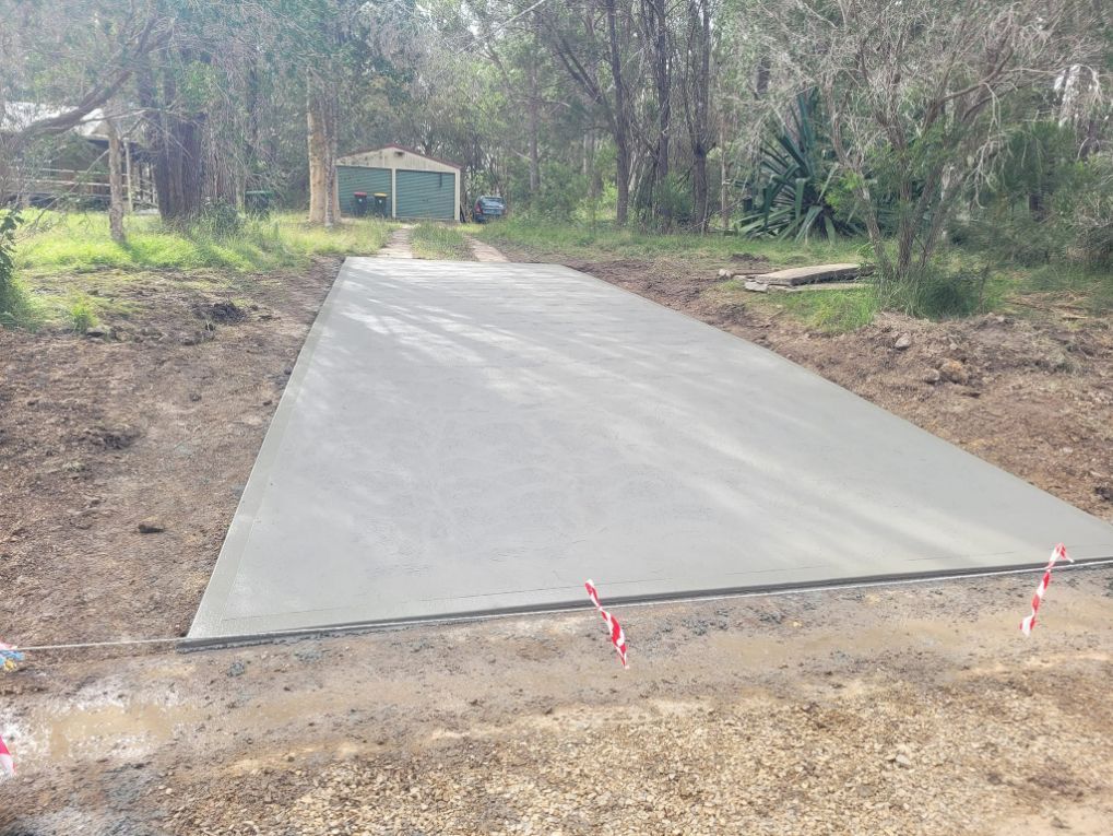 Concrete Driveway in the Woods — Kempsey Concrete Contractors In Kempsey, NSW