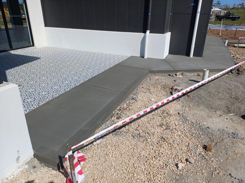 A Concrete Ramp Leads to a Building Entrance — Kempsey Concrete Contractors In Crescent Head, NSW