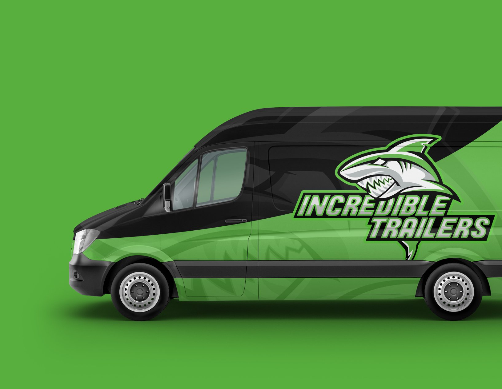 a green van with a shark on the side is on a green background .