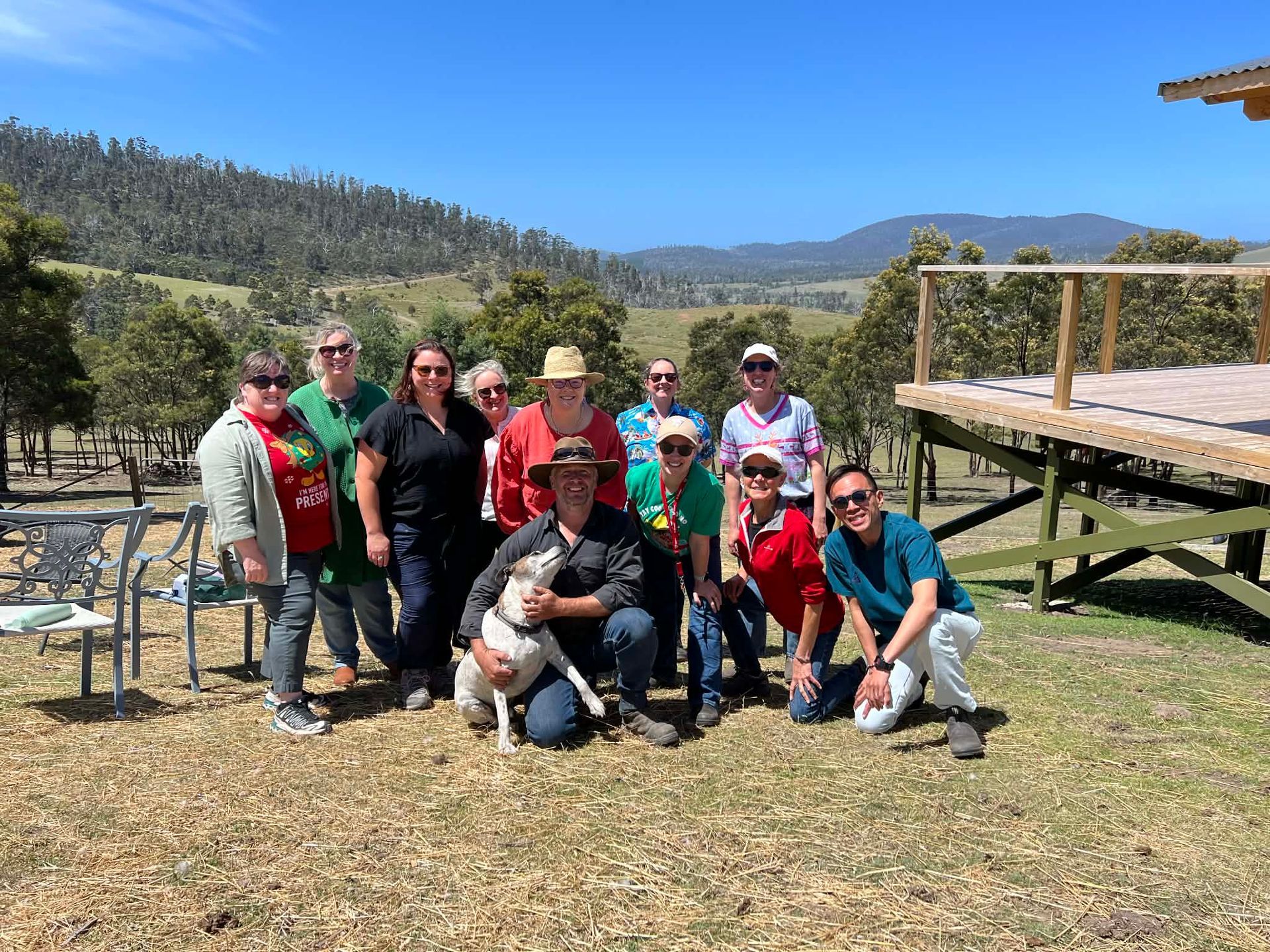 A night sky filled with lots of stars over a field.