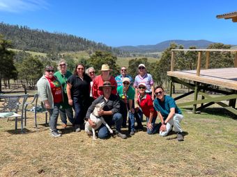A night sky filled with lots of stars over a field.