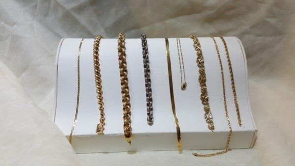 Gold Chains Are Displayed on A White Box — Palm Harbor, FL — Jensen Jewelers