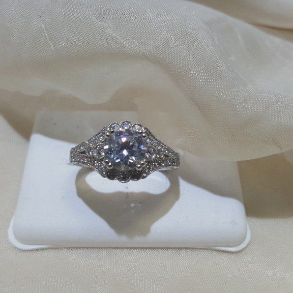A silver ring with a diamond in the center