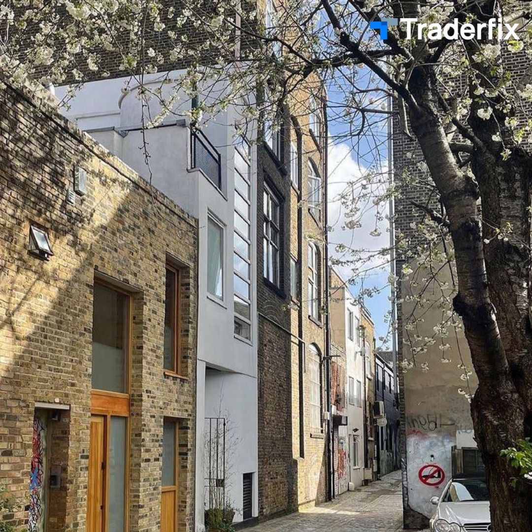 A narrow alleyway between two tall brick buildings