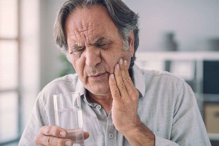 elder man with tooth pain