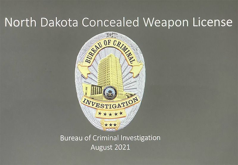 North Dakota Concealed Weapon License graphic with Bureau of Criminal Investigation badge and date August 2021.