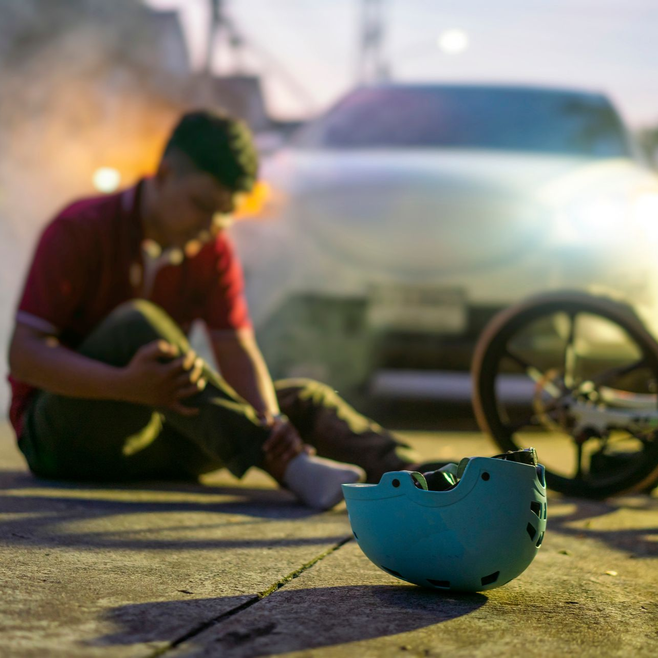 Two motorcycles colliding; riders are injured.
