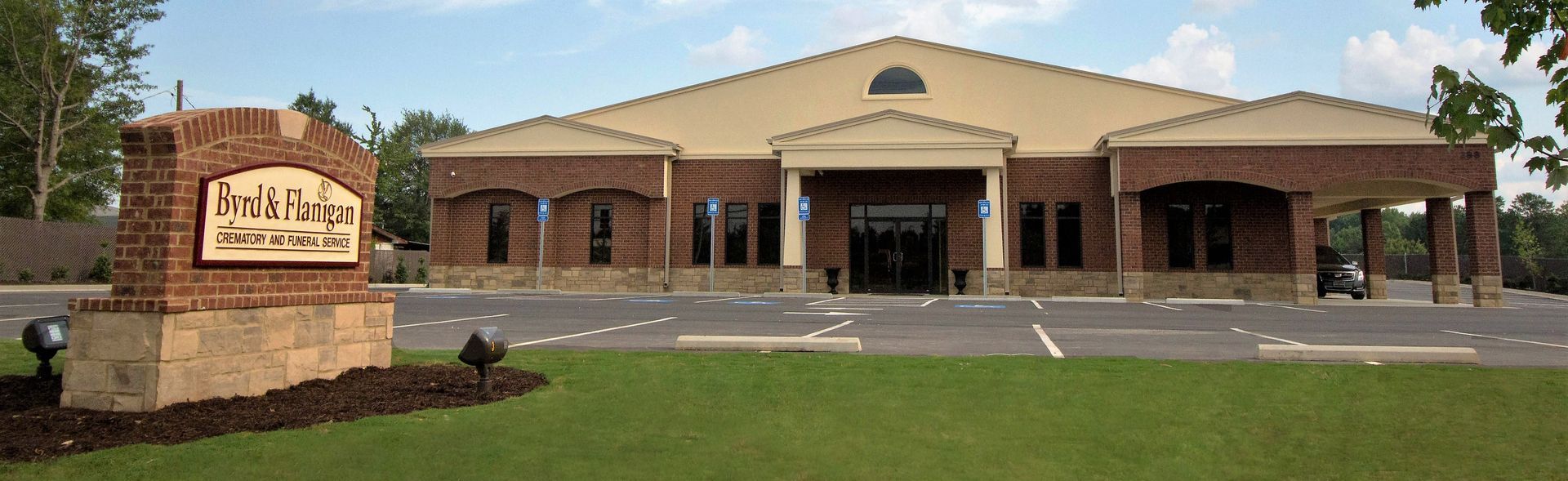 The sun is setting over the ocean and the waves are crashing on the beach.