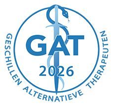 Blue GAT 2026 logo with medical caduceus and circular text “Geschillen Alternatieve Therapeuten”