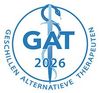 Blue GAT 2026 logo with medical caduceus and circular text “Geschillen Alternatieve Therapeuten”