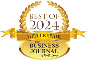 Best of 2024 Auto Repair award logo from The Business Journal of North Idaho. Gold laurels, banner, and oval.