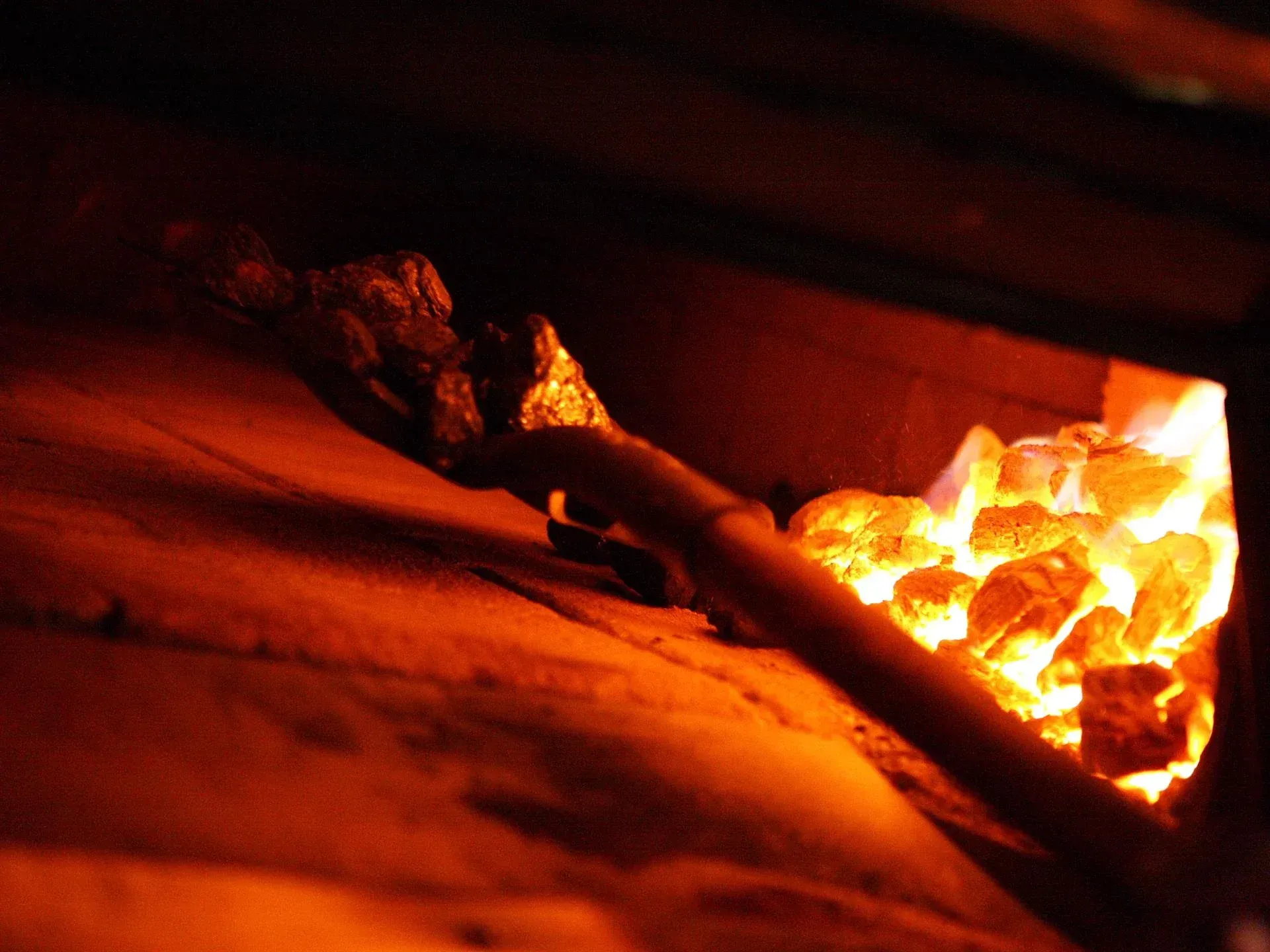 A close up of a fire in a brick oven