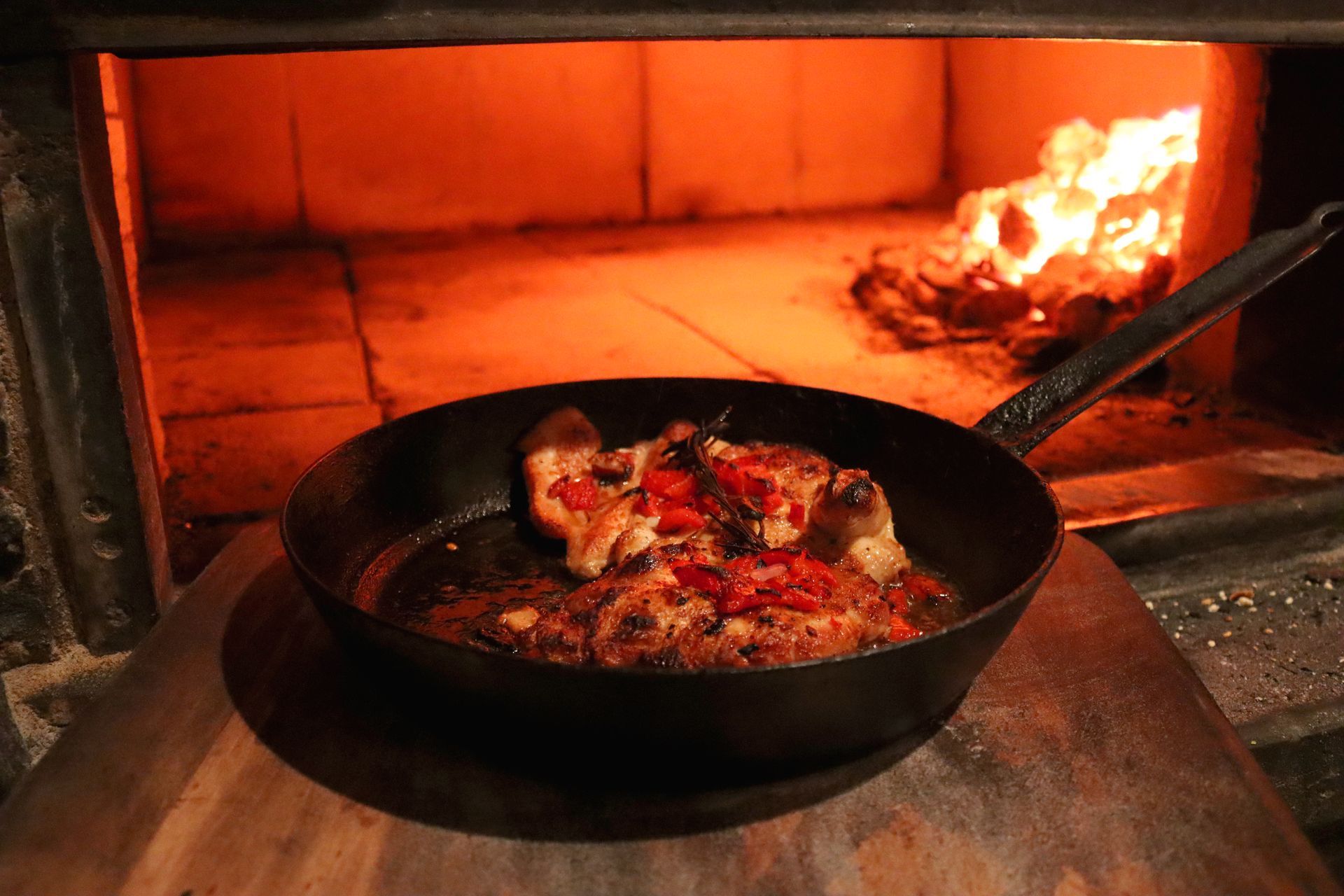 A pan of food is cooking in an oven.