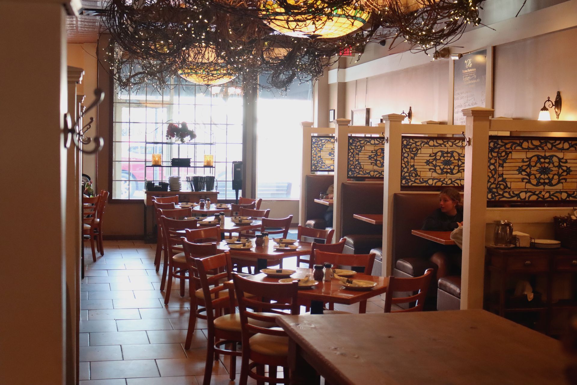 A restaurant with a lot of tables and chairs