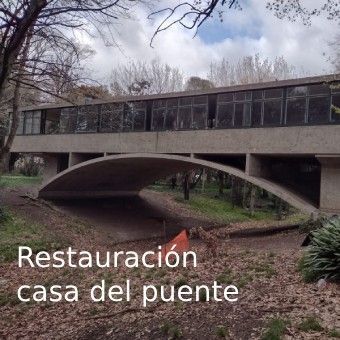 A picture of a bridge with the caption restauracion casa del puente